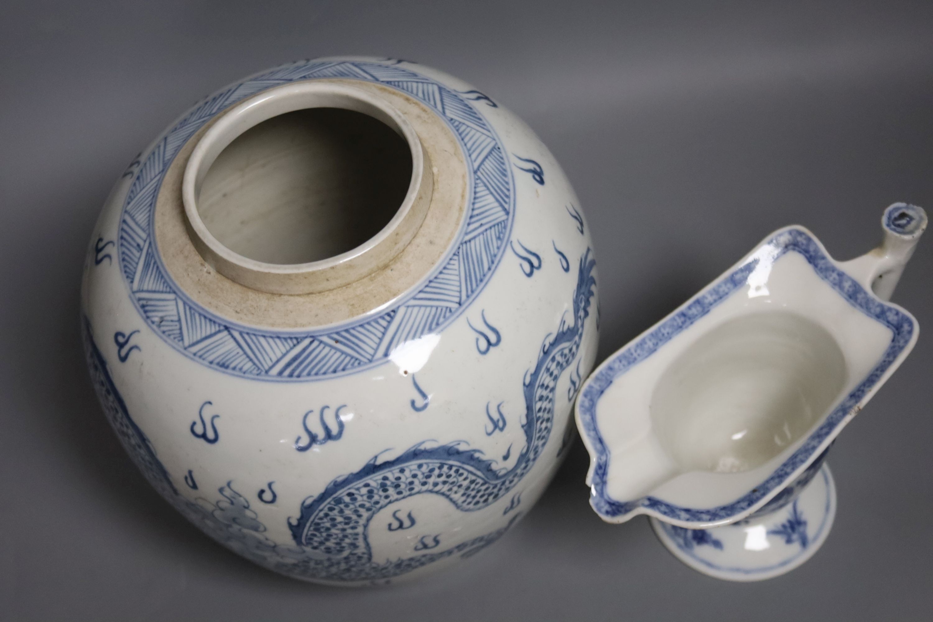 A Chinese blue and white jar, 20cm and a helmet shaped jug, 18th century and later